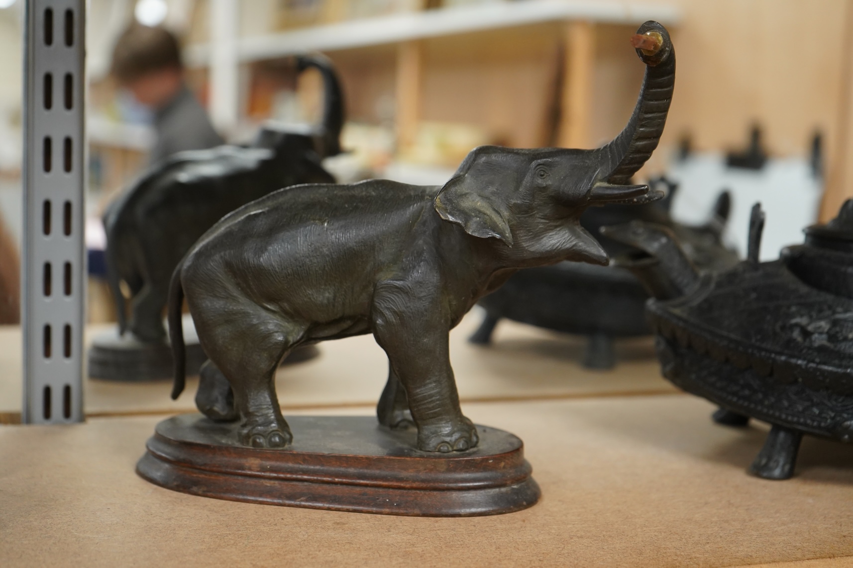A bronzed metal model of an elephant and a bronze model of a greyhound, tallest 20cm